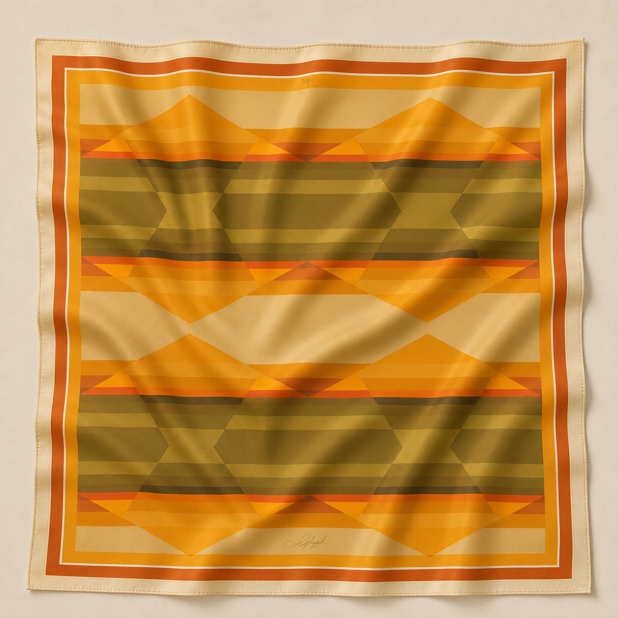 Amber Field silk scarf by Glyph, featuring a geometric design in warm amber, golden, olive and earthy tones.